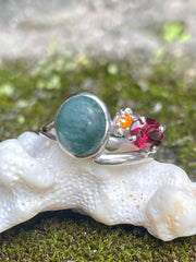 Close up of Indian Catseye, Yellow Quartz & Garnet Silver Ring on a coral in Sri Lanka - Kalumali artisan Design